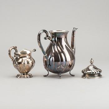 A DANISH COFFEE POT AND A SWEDISH CREAMER, silver.