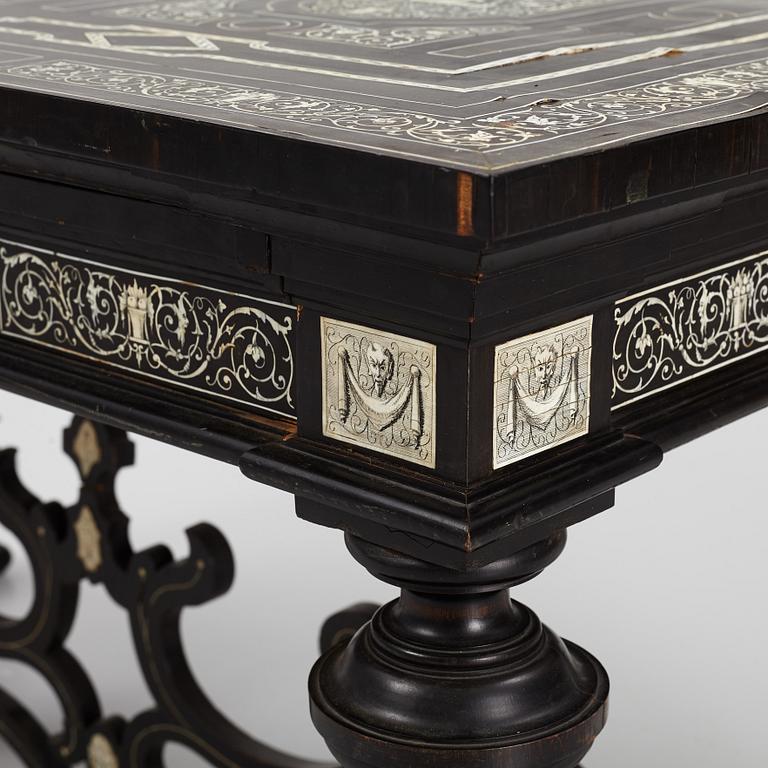 A Renaissance-style ebony, ebonized and ivory-inlaid library table, late 19th century, presumably Germany.