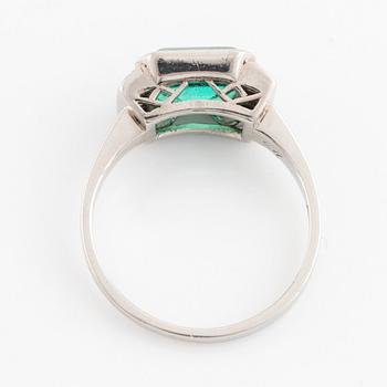 Platinum and emerald and eight cut diamond ring.