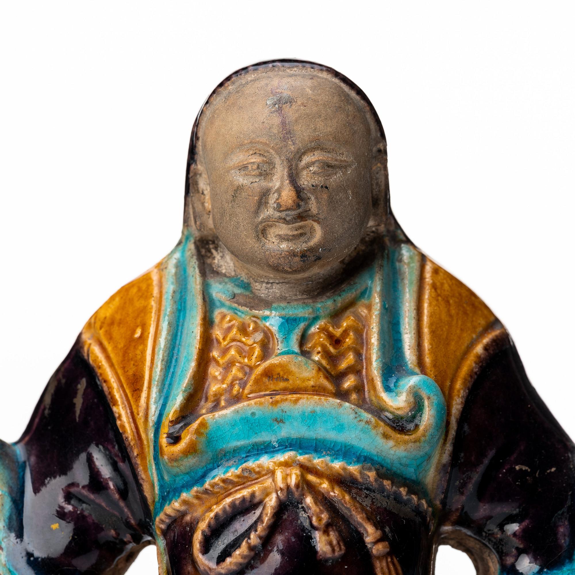 A pottery figure of a the warrior god Guandi, Ming dynasty (1368-1644).