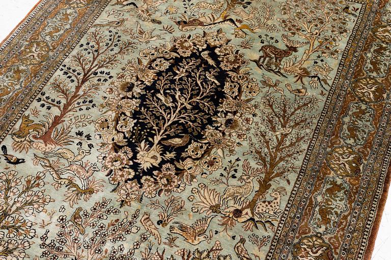 A Ghom, figural, silk rug, c. 205 x 140 cm.
