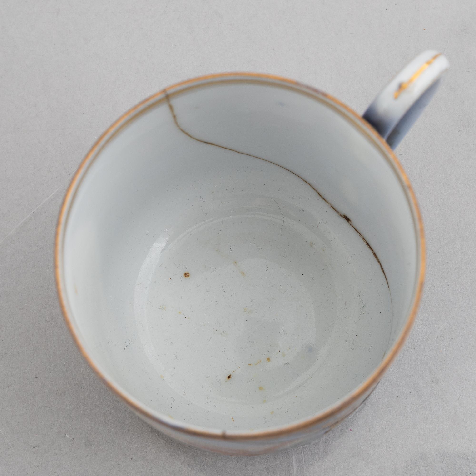 A set of nine porcelain coffee cups with saucers, Kuznetsov, Russia (1891-1917).