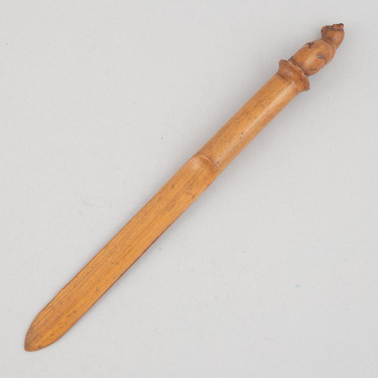 A carved wooden letter opener in the manner of Sophia Isberg, 19th century.
