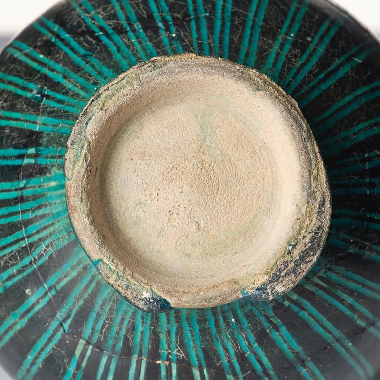 A Kashan Silhouette ware turquoise glazed pottery jug, central Iran, circa 1200.