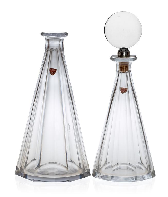 Two Wiwen Nilsson and Orrefors glass decanters, the one with a sterling stopper, Lund 1949.