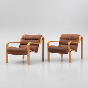 A pair of armchairs, Dux, Sweden, late 20th century.