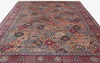 A semi-antique Kerman carpet, of Safavid 'vase' design, ca 484 x 291 cm.