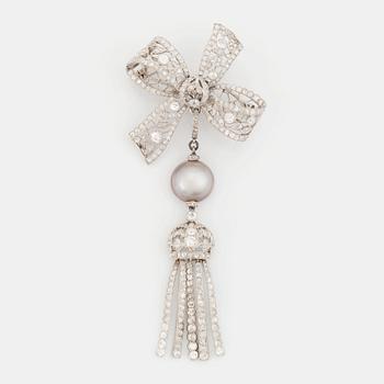 448. A platinum bow brooch set with old-cut diamonds with a detachable pearl and platinum pendant.