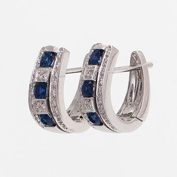 Earrings 18K white gold with faceted sapphires and round brilliant-cut diamonds.