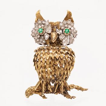 An 14K white and red gold brooch set with single cut diamonds and possibly emeralds.