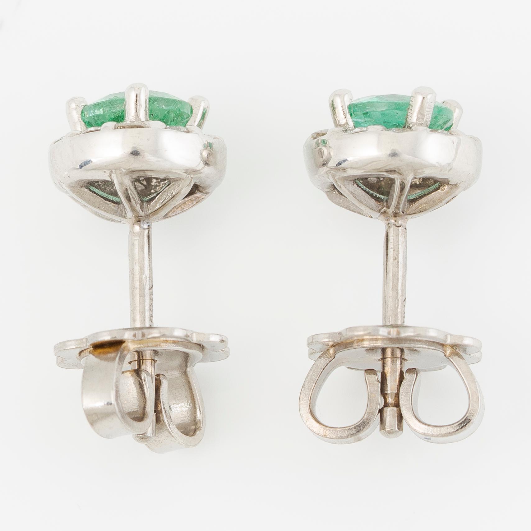 Earrings 14K white gold with emeralds and brilliant-cut diamonds.