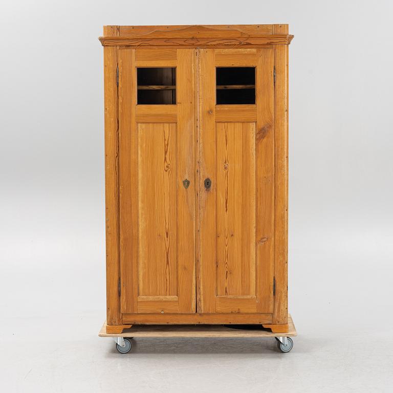 A pinewood cabinet, later part of the 19th Century.