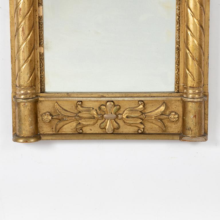An empire style mirror, second half of the 19th century.
