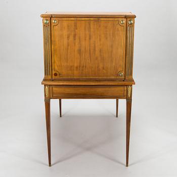 A 20th-century Louis XVI style mahogany veneered writing desk.