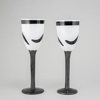 Ulrica Hydman-Vallien, a glass vase, goblet, and six glasses from Kosta Boda, signed and numbered.