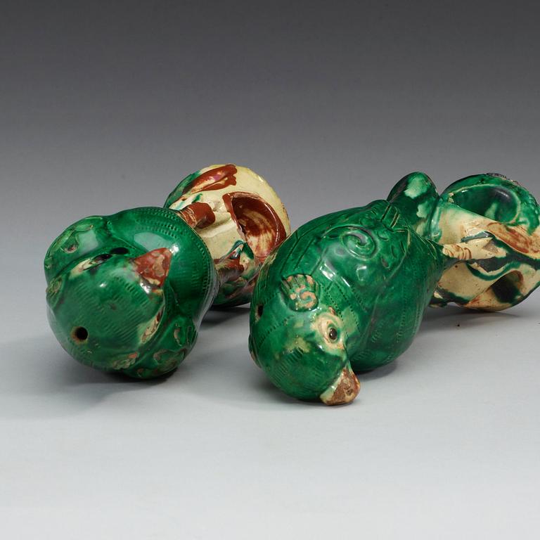 A set of two green glazed falcons, China.