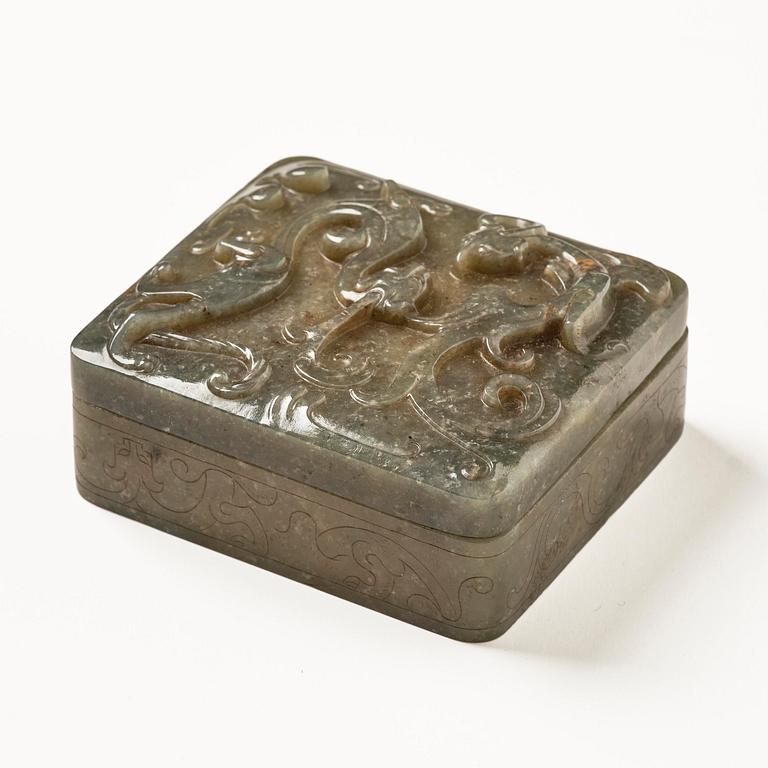 A well carved green stone box with cover, China, 20th century.
