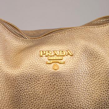 A Prada leather handbag.