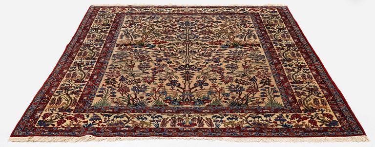 A semi-antique Qum carpet, Central Persia, c. 312 x 215 cm.