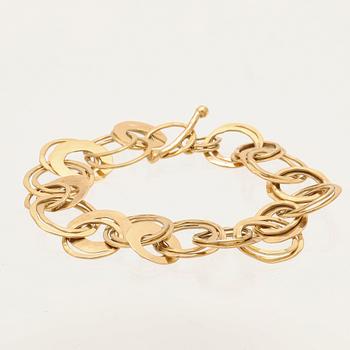 An 18K gold bracelet from Cusi Italy.