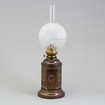 A COPPER OIL LAMP, ca 1900.