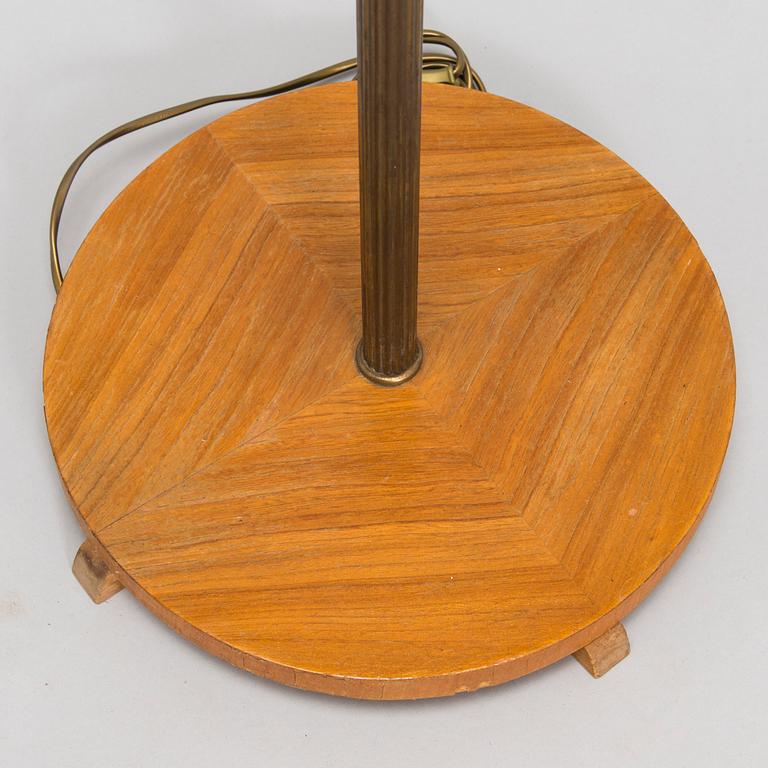 A brass floor lamp, mid-20th century.