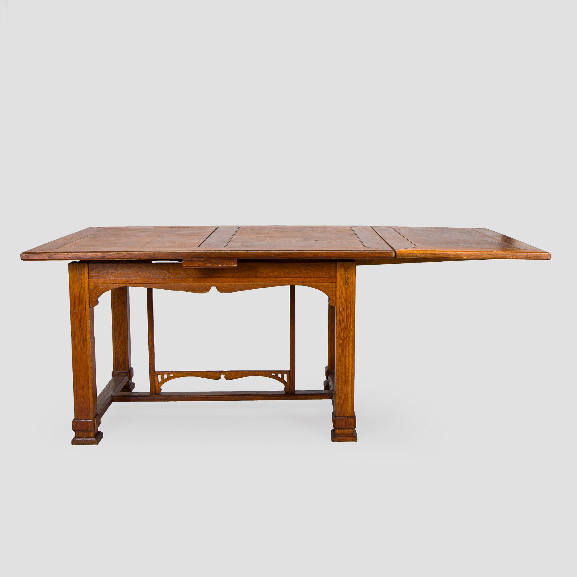 Dining table and six chairs, early 1900.