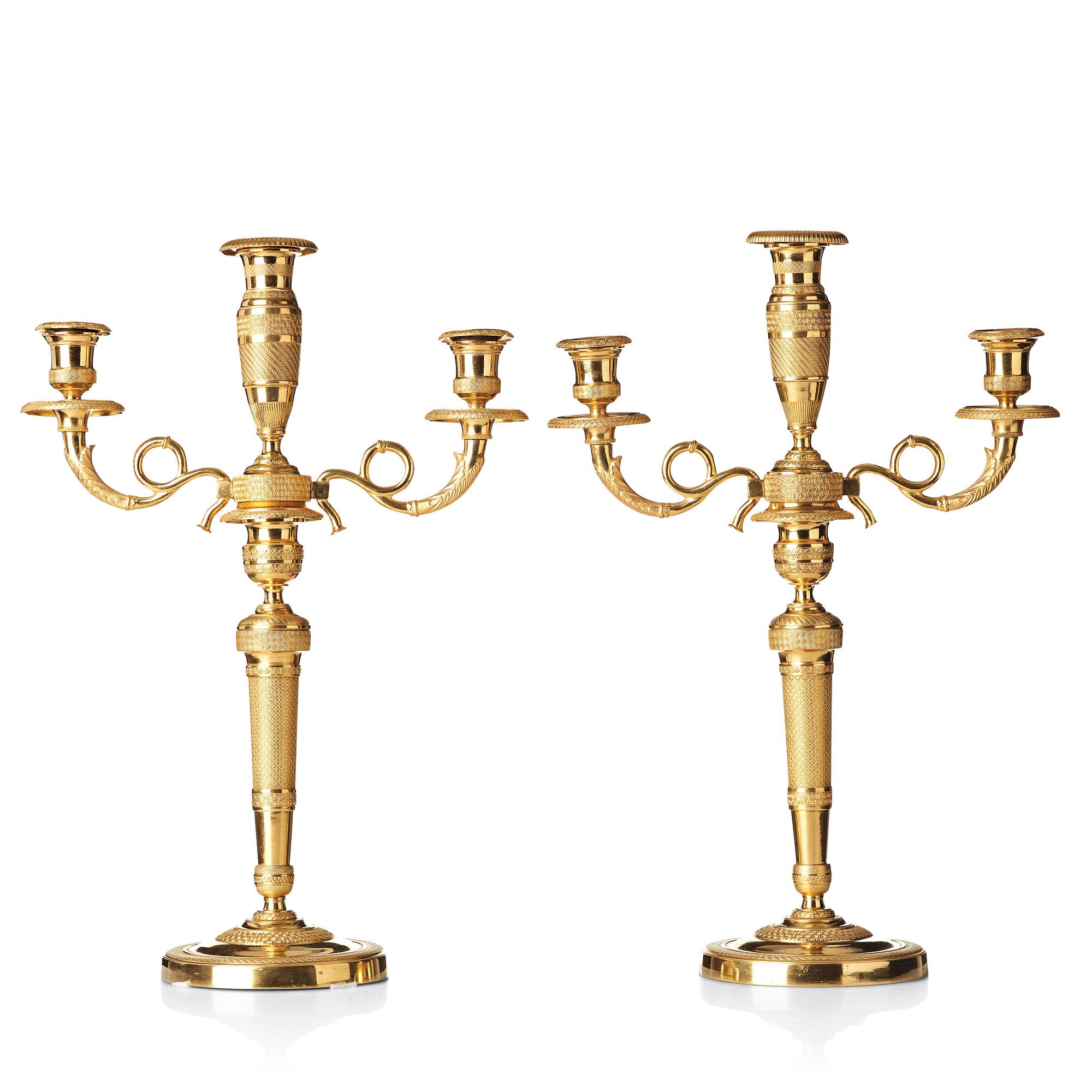 A pair of French Empire three-light candelabra, beginning of 19th century.