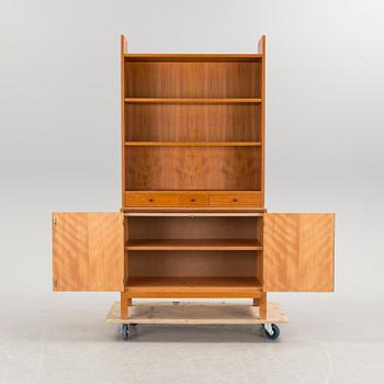 A teak vaneered book case, 1950's/60's.