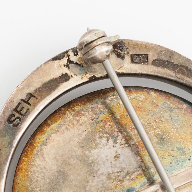 Two brooches, silver with chalcedony and white stones, SE Högberg, Gothenburg 1964 and H Strömdahl, Stockholm.