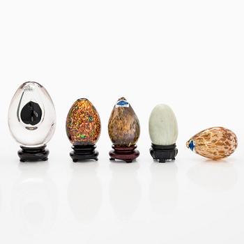 A set of 10 glass and stone decorative eggs.