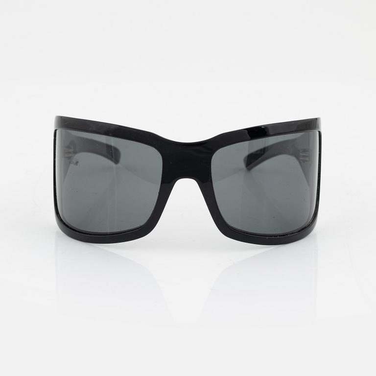 Bottega Veneta, a pair of sunglasses.