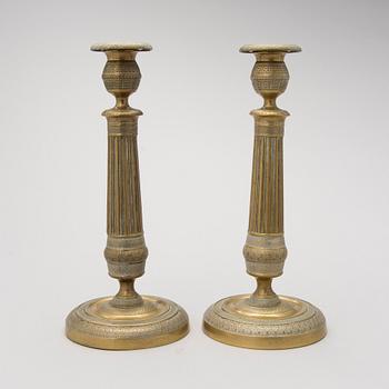 A pair of 19th Century brass candlesticks.