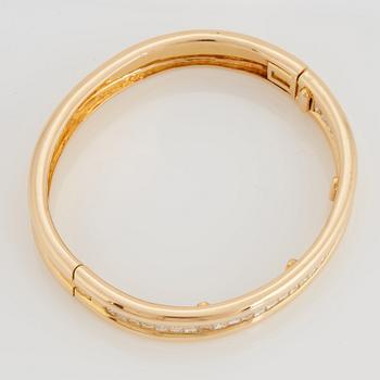 An 18K gold bracelet set with baguette-cut diamonds 7.715 cts according to engraving.