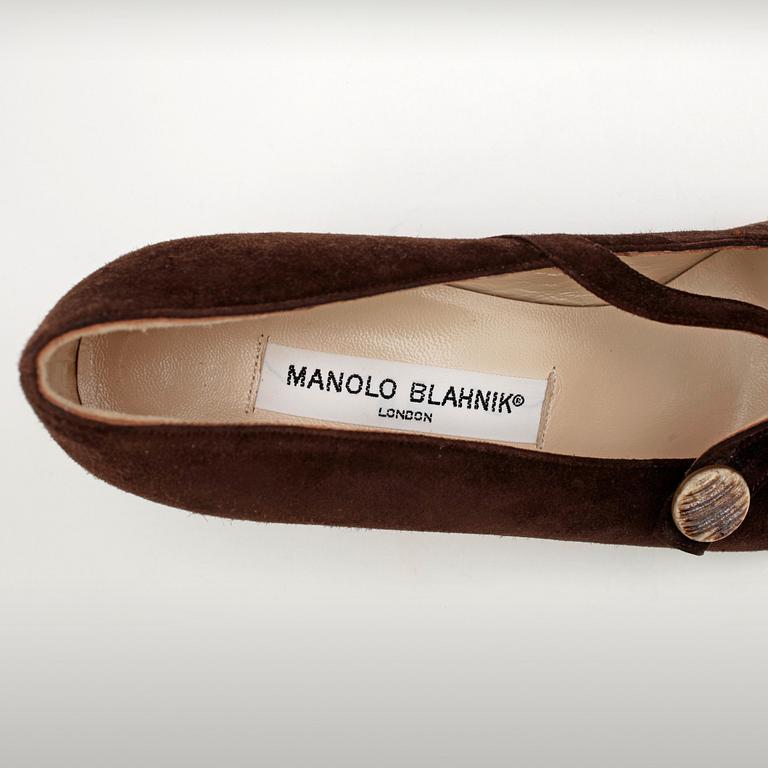 MANOLO BLAHNIK, a pair of brown suede pumps.