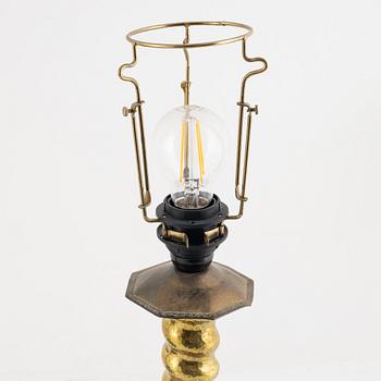 Two Baroque style brass table lamps from around the year 1900.