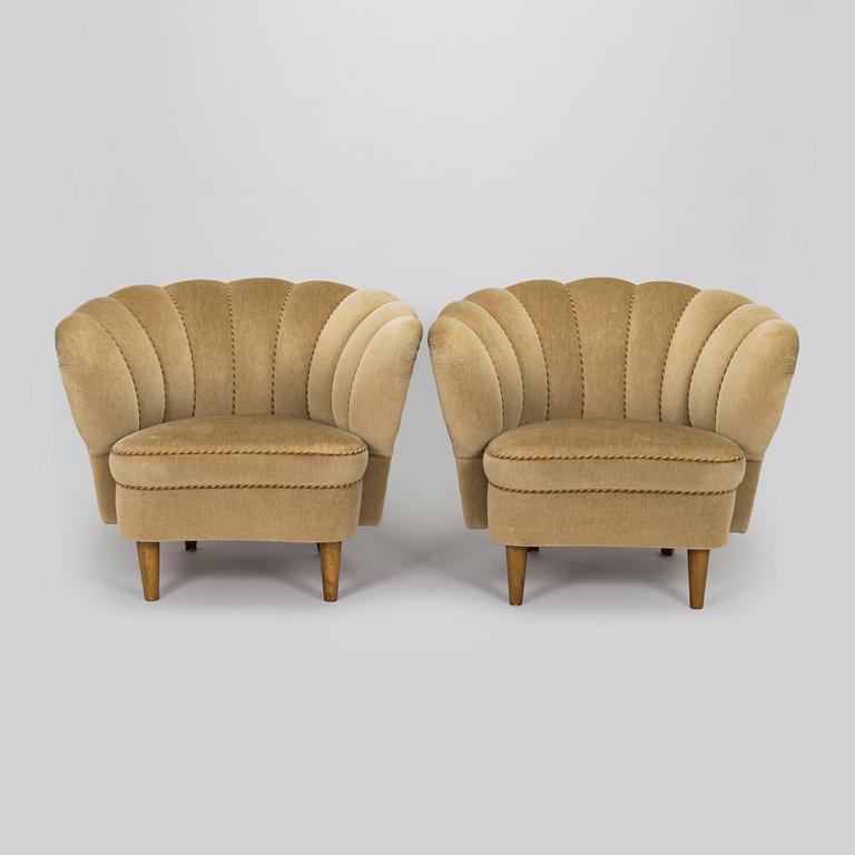 A pair of mid-20th century armchairs.