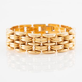 A bracelet in 18K gold.