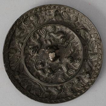 A bronze mirror, presumably Tang dynasty (618-906).