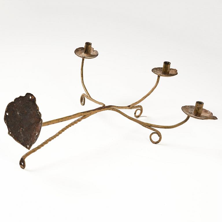 A Swedish wrought iron three-branch wall light, 17th / 18th century.