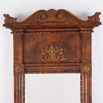 A mirror and console table, first half of the 19th century.