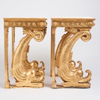 A pair of Swedish Empire carved and giltwood console tables, first half of the 19th century.