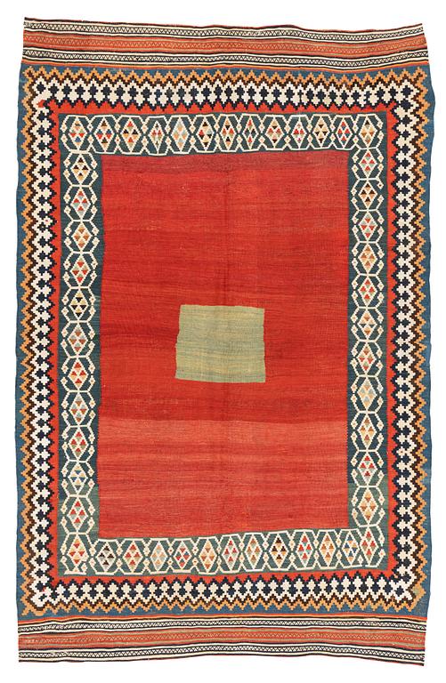 An antique Qashqai kilim rug, approximately 240 x 155 cm.