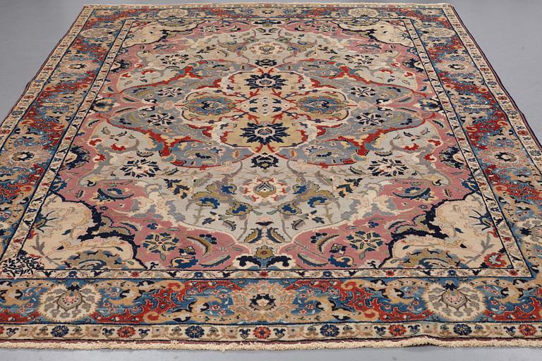 A CARPET, semi-antique, Tabriz, signed Jabarzade ca 337,5 x 242,5 cm.