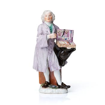 A Meissen porcelain figure of a trinket salesman from the series of Parisian street-traders, circa 1745.