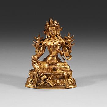 219. A gilt bronze figure of a seated Green Tara, Tibeto-Chinese, 18th Century.