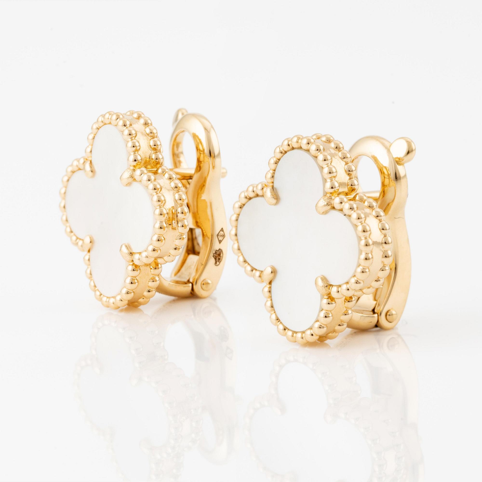 A Van Cleef & Arpels a pair of earrings "Alhambra" 18K gold and Mother-of-pearl.