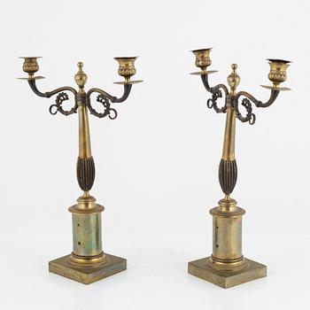 A pair of Empire style candelabra, early 20th Century.