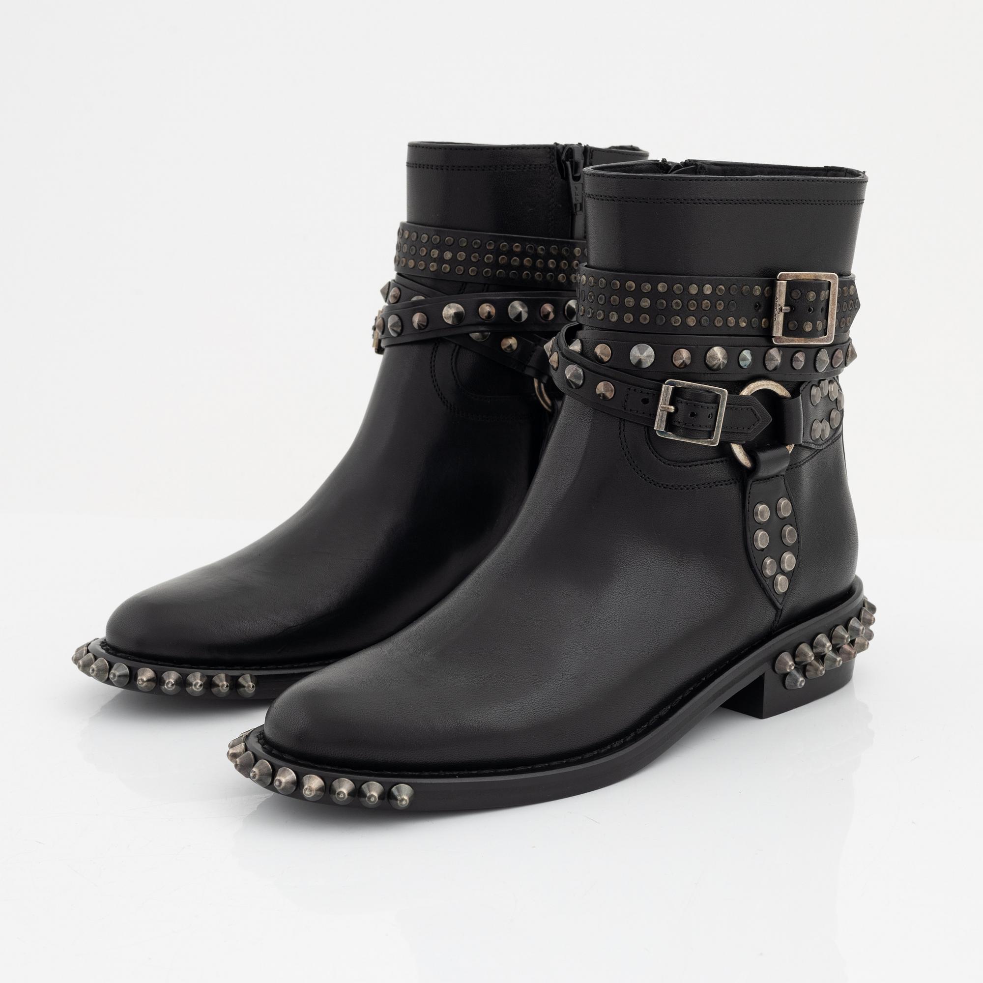Yves Saint Laurent, a pair of black leather and studs boots, size 38.