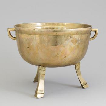 A 19th century brass stew.